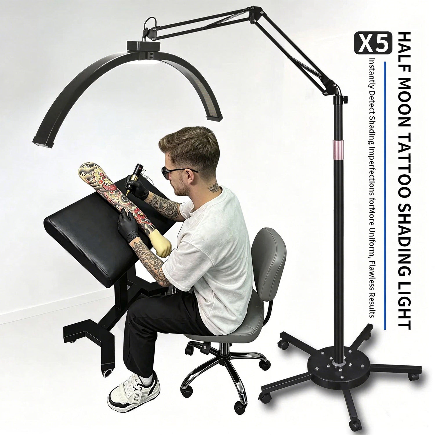 Tattoo artist working under the TAIDU X5 half-moon floor stand lamp